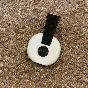 A sling shoulder bag and a perfume